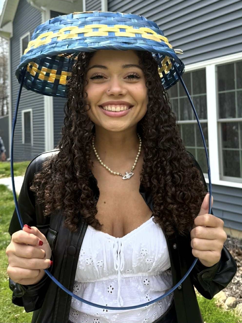 Portrait of Hailey with an Easter basket over her head